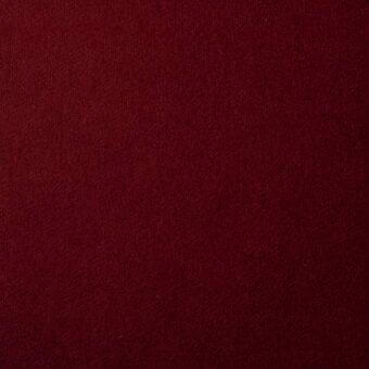 Burgundy knit fabric swatch with matte finish, displaying “bonaldo fabrics st moritz mc69” label, even lighting, subtle vertical ribbing.